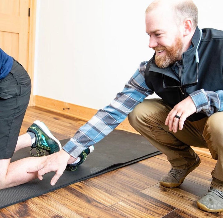 Physical therapist helping a patient