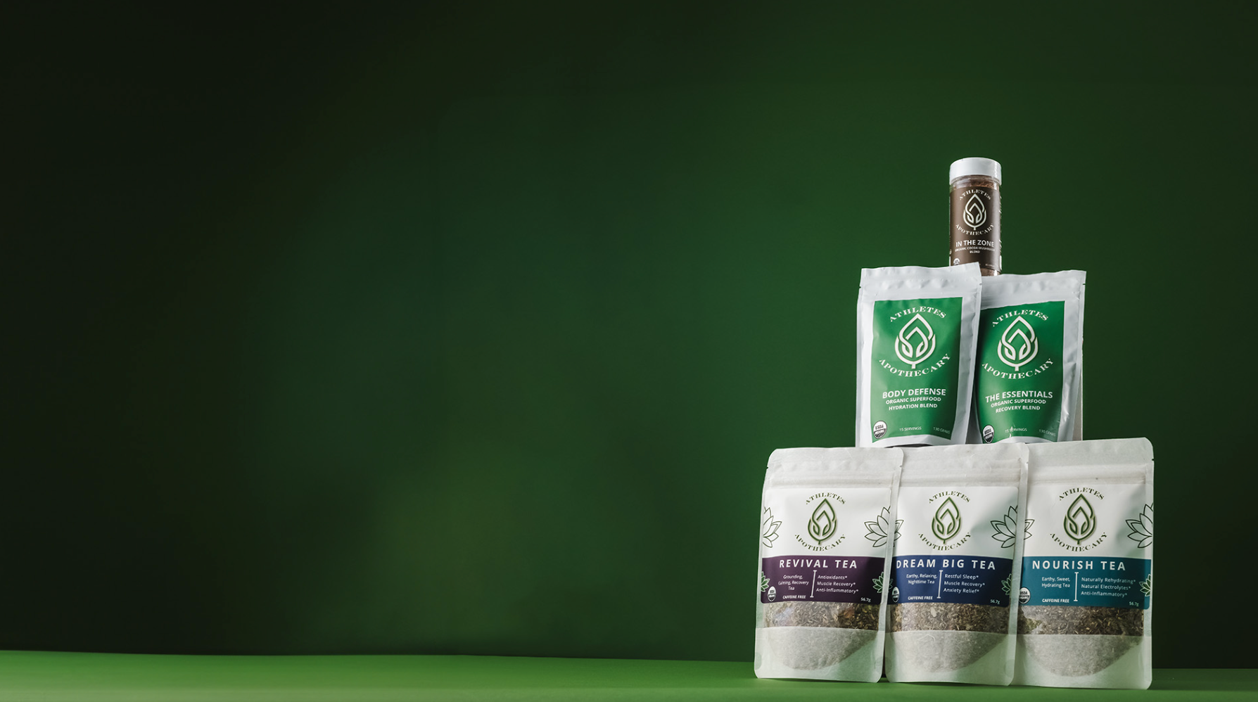 All natural sports drink blends, including teas and superfoods, to the right and an open space to the left with a green background