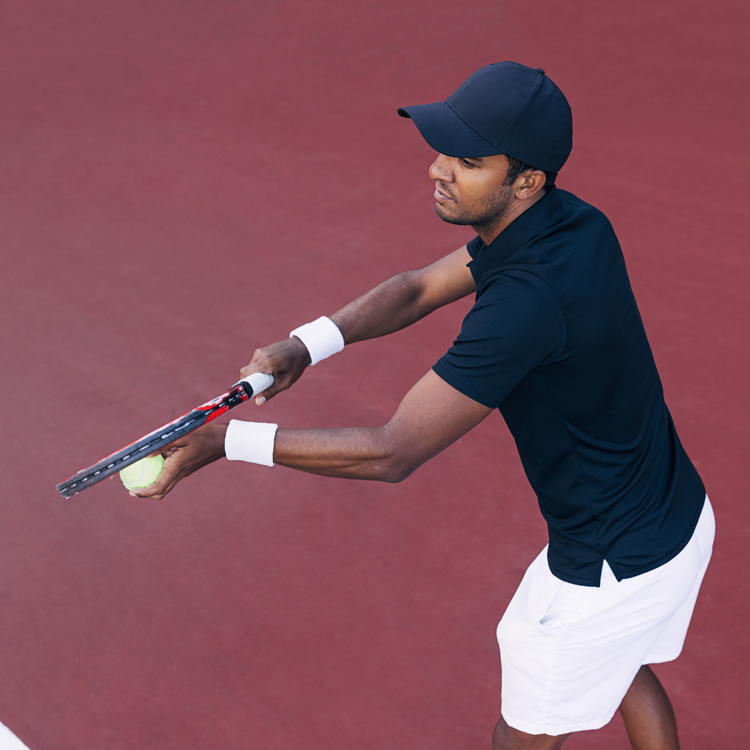 Focused tennis player preparing to serve
