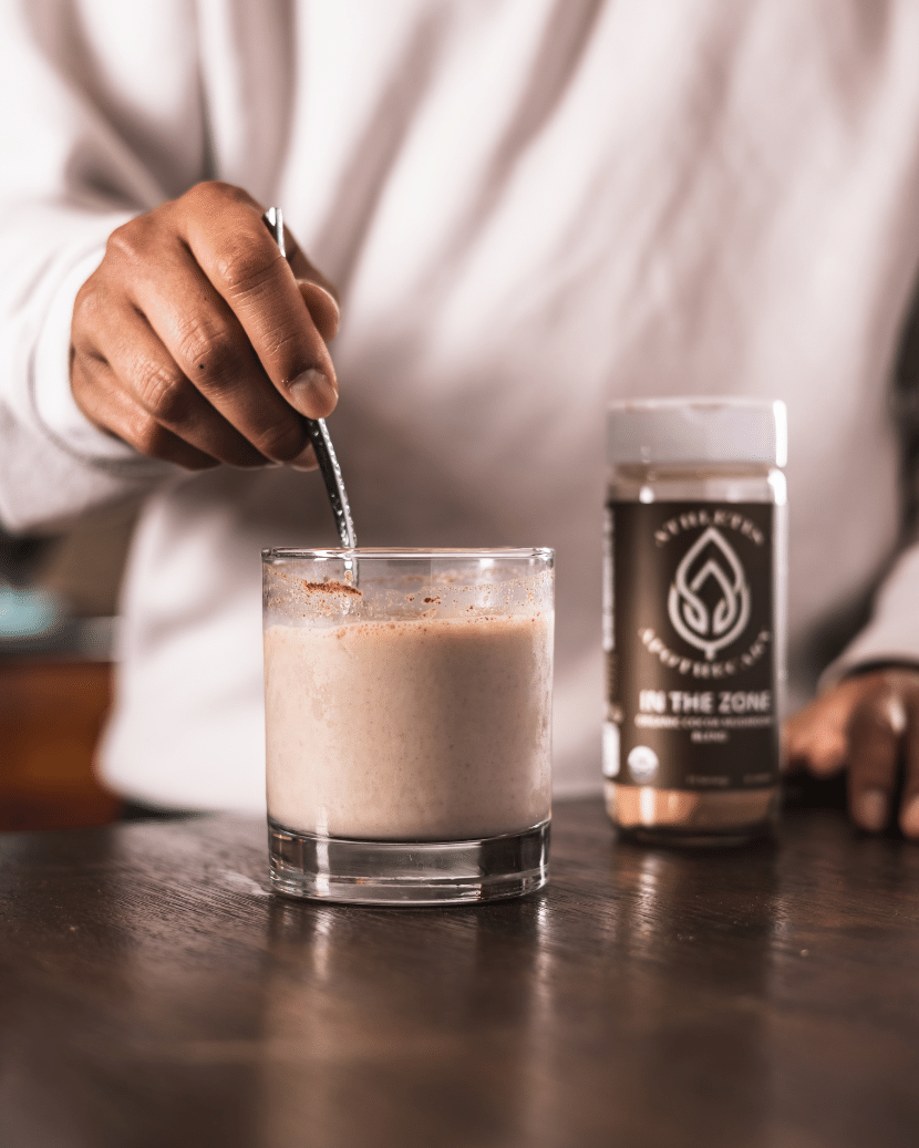 Mushroom blend being stirred with a spoon.