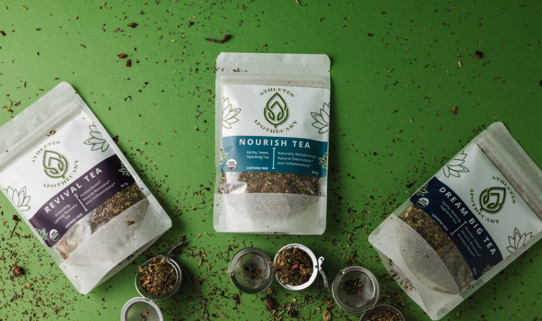 Loose leaf tea blends for athletes with tea balls and tea shrapnel spread throughout
