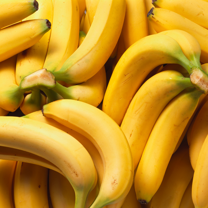 A pile of bananas in mood lighting.