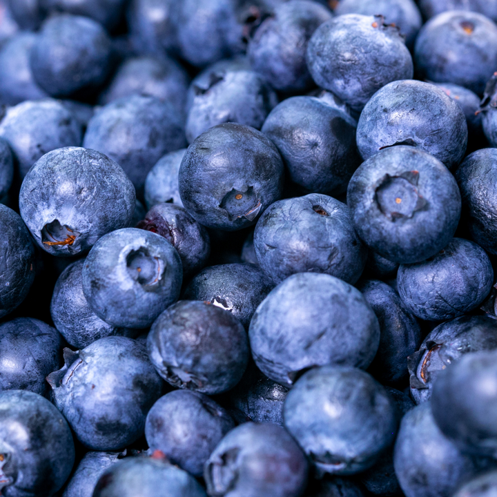 A pile of blueberries form a close up angle